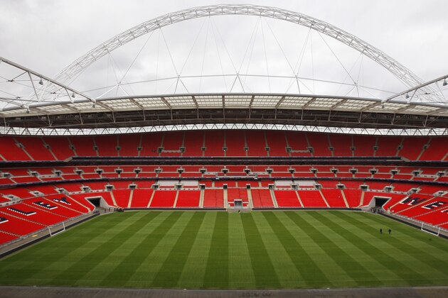 FILE - In this Thursday, May 7, 2009 file photo a view of Wembley Stadium in London .  Not so long ago, the world's top sports events bypassed Britain because of a combination of poor finances and arrogance. Now they can't wait to get a taste of Wembley, Lord's, Old Trafford and Twickenham.   A decade ago, England's bid to stage football's 2006 World Cup was a flop and, when Britain was effectively handed the 2005 World Championships of athletics, it had to pull out because plans to build a new stadium in North London were scrapped on financial and transportation grounds. (AP Photo/Kirsty Wigglesworth, File)