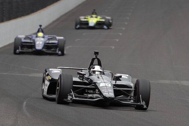 Ed Carpenter heads into the first turn during a practice session for the IndyCar Indianapolis 500 auto race at Indianapolis Motor Speedway, in Indianapolis Monday, May 21, 2018. (AP Photo/Michael Conroy)