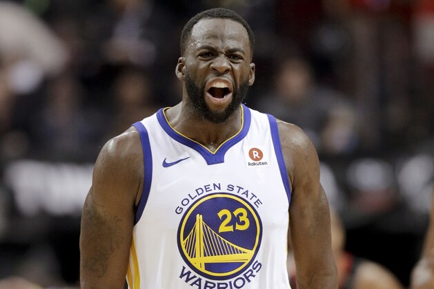 Golden State Warriors forward Draymond Green reacts after making a basket against the Houston Rockets during the second half in Game 5 of the NBA basketball playoffs Western Conference finals in Houston, Thursday, May 24, 2018. (AP Photo/David J. Phillip)