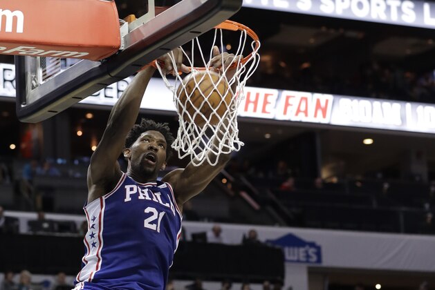 Philadelphia 76ers' Joel Embiid (21) dunks against the Charlotte Hornets during the second half of an NBA basketball game in Charlotte, N.C., Tuesday, March 6, 2018. (AP Photo/Chuck Burton)