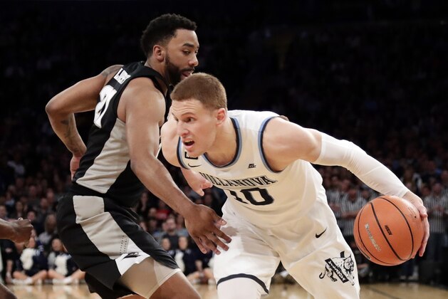 Villanova's Donte DiVincenzo (10) drives past Providence's Jalen Lindsey (21) during the first half of an NCAA college basketball game in the Big East men's tournament final Saturday, March 10, 2018, in New York. (AP Photo/Frank Franklin II)