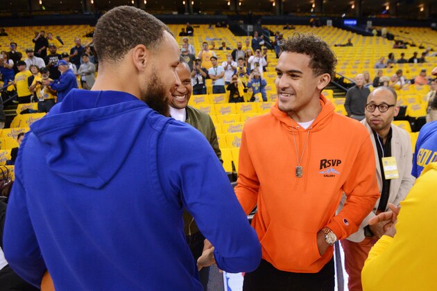 OAKLAND, CA - MAY 8: Stephen Curry #30 of the Golden State Warriors and Trae Young shake hands before Game Five of the Western Conference Semifinals against the New Orleans Pelicans during the 2018 NBA Playoffs on May 8, 2018 at ORACLE Arena in Oakland, California. NOTE TO USER: User expressly acknowledges and agrees that, by downloading and/or using this photograph, user is consenting to the terms and conditions of Getty Images License Agreement. Mandatory Copyright Notice: Copyright 2018 NBAE (Photo by Noah Graham/NBAE via Getty Images)