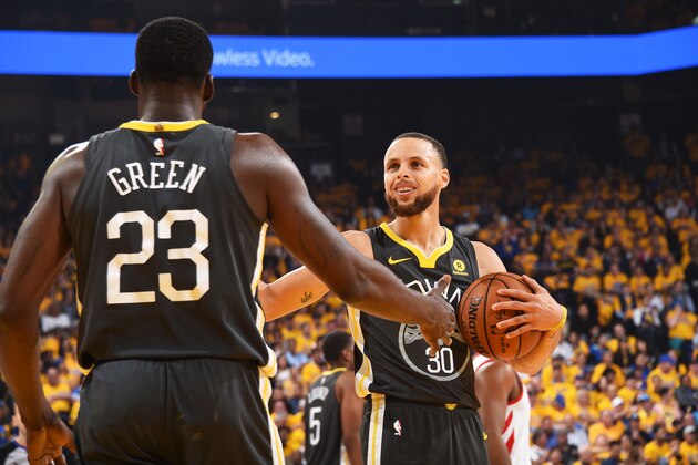 OAKLAND, CA - MAY 22: Stephen Curry #30 igh fives Kevin Durant #35 of the Golden State Warriors during Game Four of the Western Conference Finals during the 2018 NBA Playoffs on May 20, 2018 at ORACLE Arena in Oakland, California. NOTE TO USER: User expressly acknowledges and agrees that, by downloading and/or using this Photograph, user is consenting to the terms and conditions of the Getty Images License Agreement. Mandatory Copyright Notice: Copyright 2018 NBAE (Photo by Andrew D. Bernstein/NBAE via Getty Images)