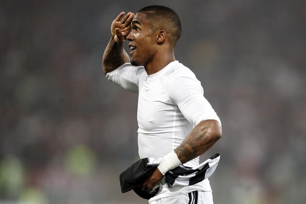 Juventus' Douglas Costa celebrates after scoring during the Italian Cup final soccer match between Juventus and AC Milan at the Rome Olympic stadium Wednesday, May 9, 2018. (Riccardo Antimiani/ANSA via AP)