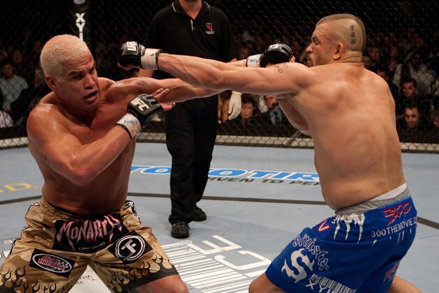 LAS VEGAS - DECEMBER 30:  (L-R) Tito Ortiz and Chuck Liddell exchange punches at  UFC 66 at the MGM Grand Garden Arena on December 30, 2006 in Las Vegas, Nevada.  (Photo by Josh Hedges/Zuffa LLC/Zuffa LLC via Getty Images)