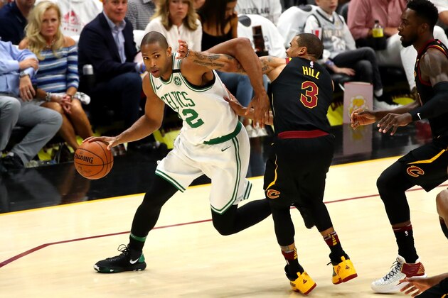 CLEVELAND, OH - MAY 25: Al Horford of the Boston Celtics handles the ball against George Hill of the Cleveland Cavaliers in the first quarter during Game Six of the 2018 NBA Eastern Conference Finals at Quicken Loans Arena on May 25, 2018 in Cleveland, Ohio. NOTE TO USER: User expressly acknowledges and agrees that, by downloading and or using this photograph, User is consenting to the terms and conditions of the Getty Images License Agreement.  (Photo by Gregory Shamus/Getty Images)