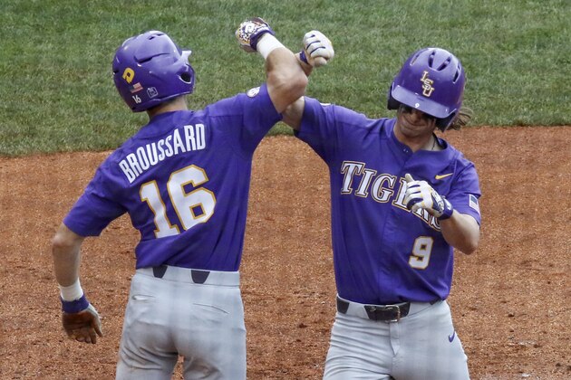 LSU's Zach Watson (9) celebrates with Brandt Broussard (16) after hitting a two-run home run during the sixth inning of a Southeastern Conference tournament NCAA college baseball game against Arkansas, Saturday, May 26, 2018, in Hoover, Ala. (AP Photo/Butch Dill)
