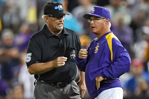 OMAHA, NE - JUNE 27:  Head coach Paul Mainieri (R) of the LSU Tigers argues an interference call with an umpire against the Florida Gators in the eighth inning during game two of the College World Series Championship Series on June 27, 2017 at TD Ameritrade Park in Omaha, Nebraska.  (Photo by Peter Aiken/Getty Images)
