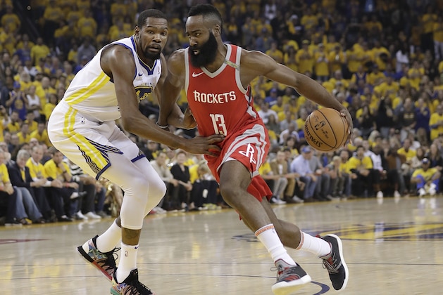 Houston Rockets guard James Harden (13) drives past Golden State Warriors forward Kevin Durant during the first half of Game 6 of the NBA basketball Western Conference Finals in Oakland, Calif., Saturday, May 26, 2018. (AP Photo/Marcio Jose Sanchez)