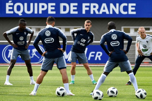 France's national football team midfielder Blaise Matuidi (L), forward Antoine Griezmann (C) and teammates warm up during a training session at the team's training camp in Clairefontaine-en-Yvelines, near Paris, on May 25, 2018, during the team's preparation for the upcoming FIFA World Cup 2018. (Photo by GERARD JULIEN / AFP)        (Photo credit should read GERARD JULIEN/AFP/Getty Images)