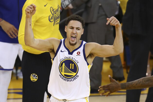 Golden State Warriors guard Klay Thompson (11) celebrates during the second half of Game 6 of the NBA basketball Western Conference Finals against the Houston Rockets in Oakland, Calif., Saturday, May 26, 2018. The Warriors won 115-86. (AP Photo/Ben Margot)