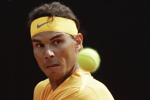 Spain's Rafael Nadal eyes the ball as he plays against Canada's Denis Shapovalov, at the Italian Open tennis tournament in Rome, Thursday, May 17, 2018 (AP Photo/Alessandra Tarantino)