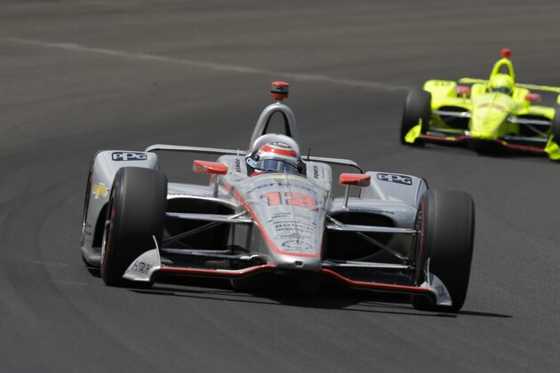 Will Power, of Australia, leads Simon Pagenaud, of France, though the first turn during the Indianapolis 500 auto race at Indianapolis Motor Speedway, in Indianapolis Sunday, May 27, 2018. (AP Photo/AJ Mast)