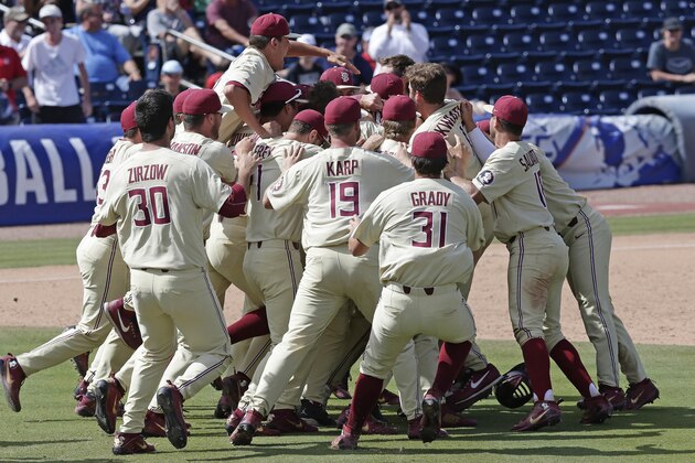 Florida State players celebrate after defeating Louisville 11-8 to win the Atlantic Coast Conference NCAA college baseball tournament championship game in Durham, N.C., Sunday, May 27, 2018. (AP Photo/Gerry Broome)