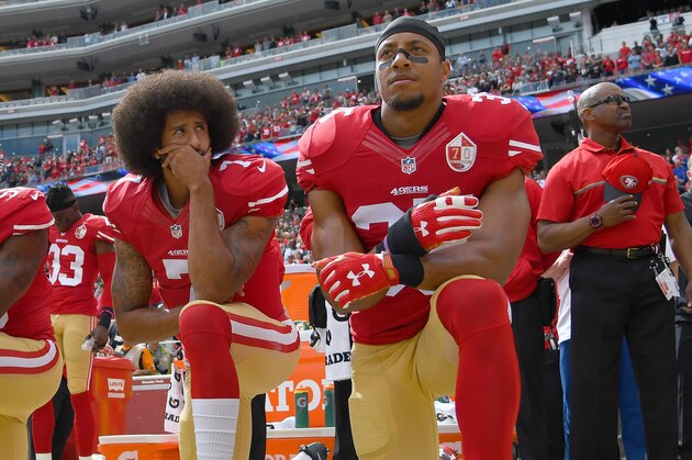 SANTA CLARA, CA - OCTOBER 02:  (L-R) Eli Harold #58, Colin Kaepernick #7 and Eric Reid #35 of the San Francisco 49ers kneel on the sideline during the National Anthem prior to the game against the Dallas Cowboys at Levi's Stadium on October 2, 2016 in Santa Clara, California.  (Photo by Thearon W. Henderson/Getty Images)