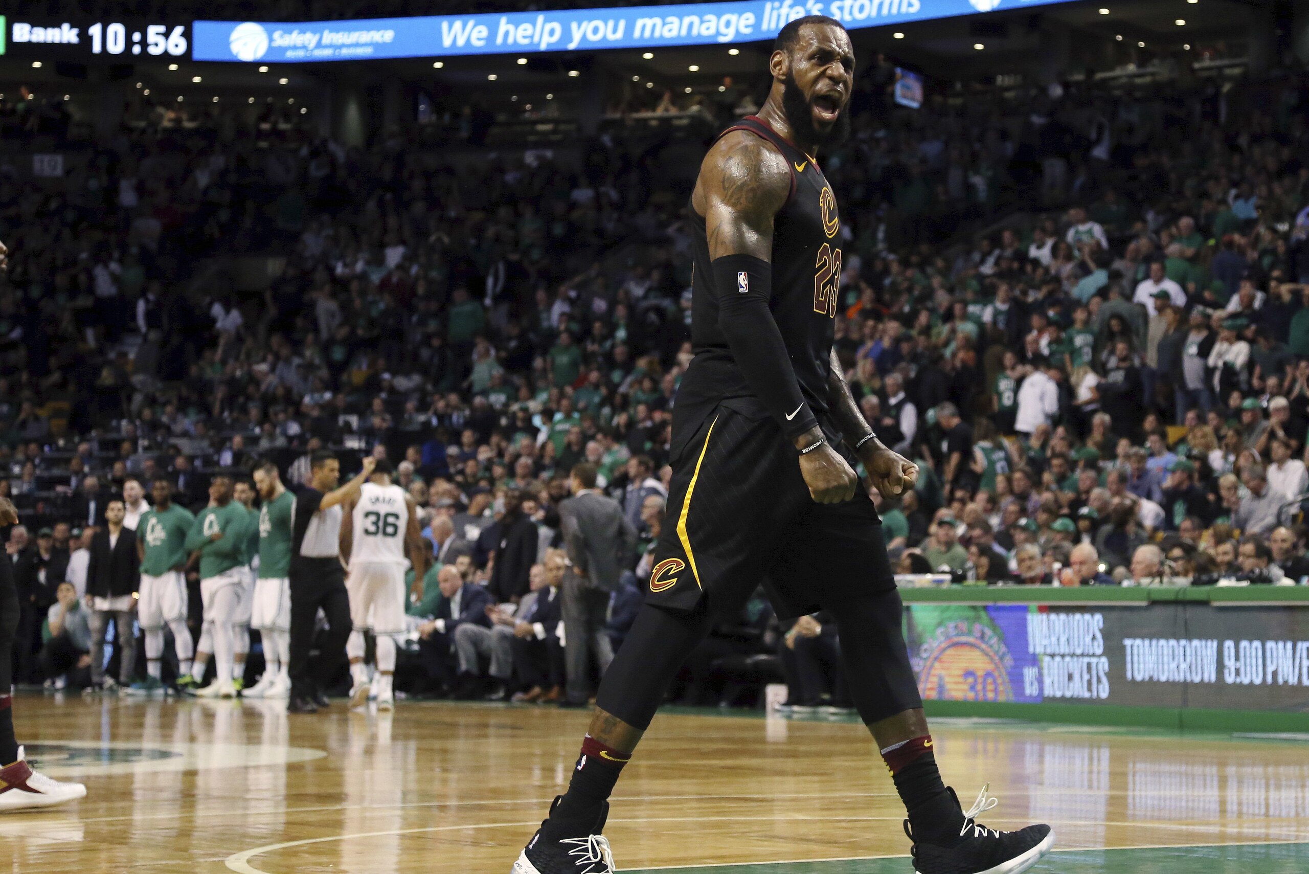 Cleveland Cavaliers forward LeBron James celebrates as his team pulls away from the Boston Celtics near the end of the second half in Game 7 of the NBA basketball Eastern Conference finals, Sunday, May 27, 2018, in Boston. (AP Photo/Elise Amendola)