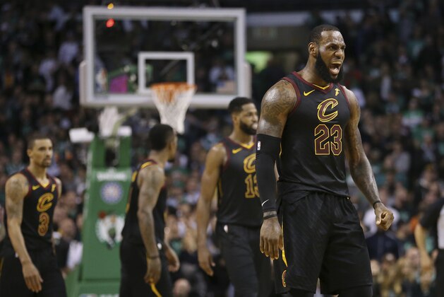 Cleveland Cavaliers forward LeBron James, right, celebrates a basket during the second half in Game 7 of the NBA basketball Eastern Conference finals against the Boston Celtics, Sunday, May 27, 2018, in Boston. (AP Photo/Elise Amendola)