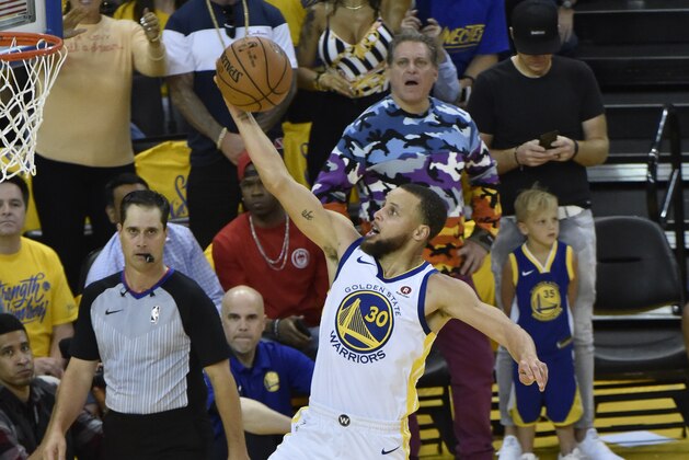 OAKLAND, CA - MAY 26:  Stephen Curry #30 of the Golden State Warriors goes to the basket against the Houston Rockets in Game Six of the Western Conference Finals during the 2018 NBA Playoffs on May 26, 2018 at ORACLE Arena in Oakland, California. NOTE TO USER: User expressly acknowledges and agrees that, by downloading and/or using this Photograph, user is consenting to the terms and conditions of the Getty Images License Agreement. Mandatory Copyright Notice: Copyright 2018 NBAE (Photo by Bill Baptist/NBAE via Getty Images)