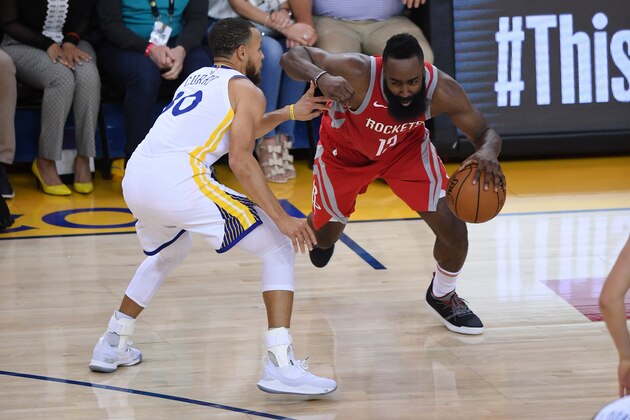 OAKLAND, CA - MAY 26:  James Harden #13 of the Houston Rockets drives with the ball against Stephen Curry #30 of the Golden State Warriors during Game Six of the Western Conference Finals in the 2018 NBA Playoffs at ORACLE Arena on May 26, 2018 in Oakland, California. NOTE TO USER: User expressly acknowledges and agrees that, by downloading and or using this photograph, User is consenting to the terms and conditions of the Getty Images License Agreement.  (Photo by Thearon W. Henderson/Getty Images)
