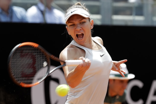 Romania's Simona Halep returns the ball to Ukraine's Elina Svitolina during the final match at the Italian Open tennis tournament, in Rome, Sunday, May 20, 2018. Svitolina won 6-0, 6-4. (AP Photo/Gregorio Borgia)
