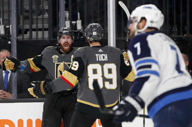 Vegas Golden Knights left wing James Neal, left, celebrates with right wing Alex Tuch (89) after scoring during the second period of Game 3 of the NHL hockey playoffs Western Conference finals against the Winnipeg Jets, Wednesday, May 16, 2018, in Las Vegas. (AP Photo/John Locher)