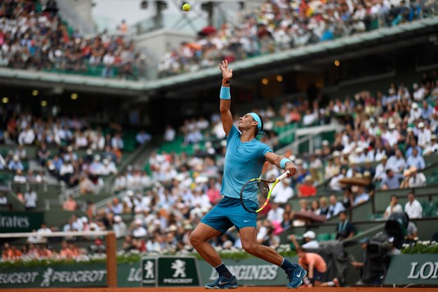 Spain's Rafael Nadal serves to Italy's Simone Bolelli during their men's singles first round match on day two of The Roland Garros 2018 French Open tennis tournament in Paris on May 28, 2018. (Photo by CHRISTOPHE SIMON / AFP)        (Photo credit should read CHRISTOPHE SIMON/AFP/Getty Images)