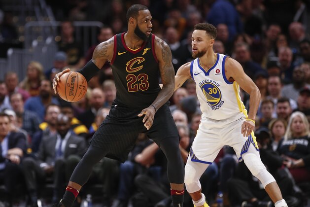 CLEVELAND, OH - JANUARY 15: LeBron James #23 of the Cleveland Cavaliers dribbles the ball against Stephen Curry #30 of the Golden State Warriors at Quicken Loans Arena on January 15, 2018 in Cleveland, Ohio. NOTE TO USER: User expressly acknowledges and agrees that, by downloading and or using this photograph, User is consenting to the terms and conditions of the Getty Images License Agreement.(Photo by Michael Hickey/Getty Images)