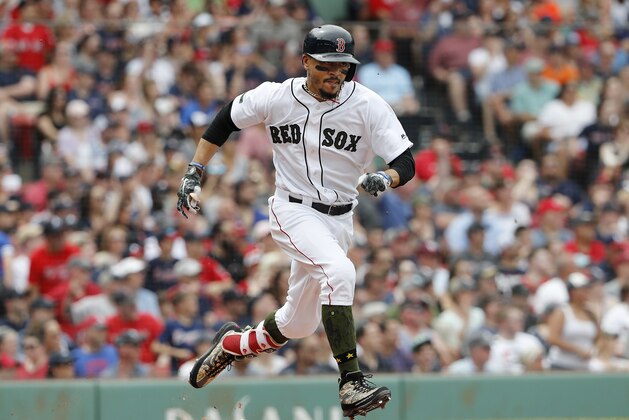 Boston Red Sox's Mookie Betts runs out a ground ball against the Atlanta Braves during the third inning of a baseball game at Fenway Park in Boston Saturday, May 26, 2018. (AP Photo/Winslow Townson)