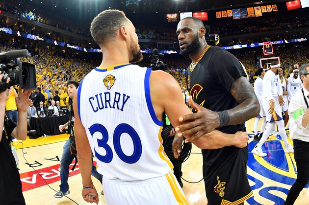 OAKLAND, CA - JUNE 12: LeBron James #23 of the Cleveland Cavaliers talks with Stephen Curry #30 of the Golden State Warriors in Game Five of the 2017 NBA Finals on June 12, 2017 at ORACLE Arena in Oakland, California. NOTE TO USER: User expressly acknowledges and agrees that, by downloading and or using this photograph, user is consenting to the terms and conditions of Getty Images License Agreement. Mandatory Copyright Notice: Copyright 2017 NBAE (Photo by Jesse D. Garrabrant/NBAE via Getty Images)