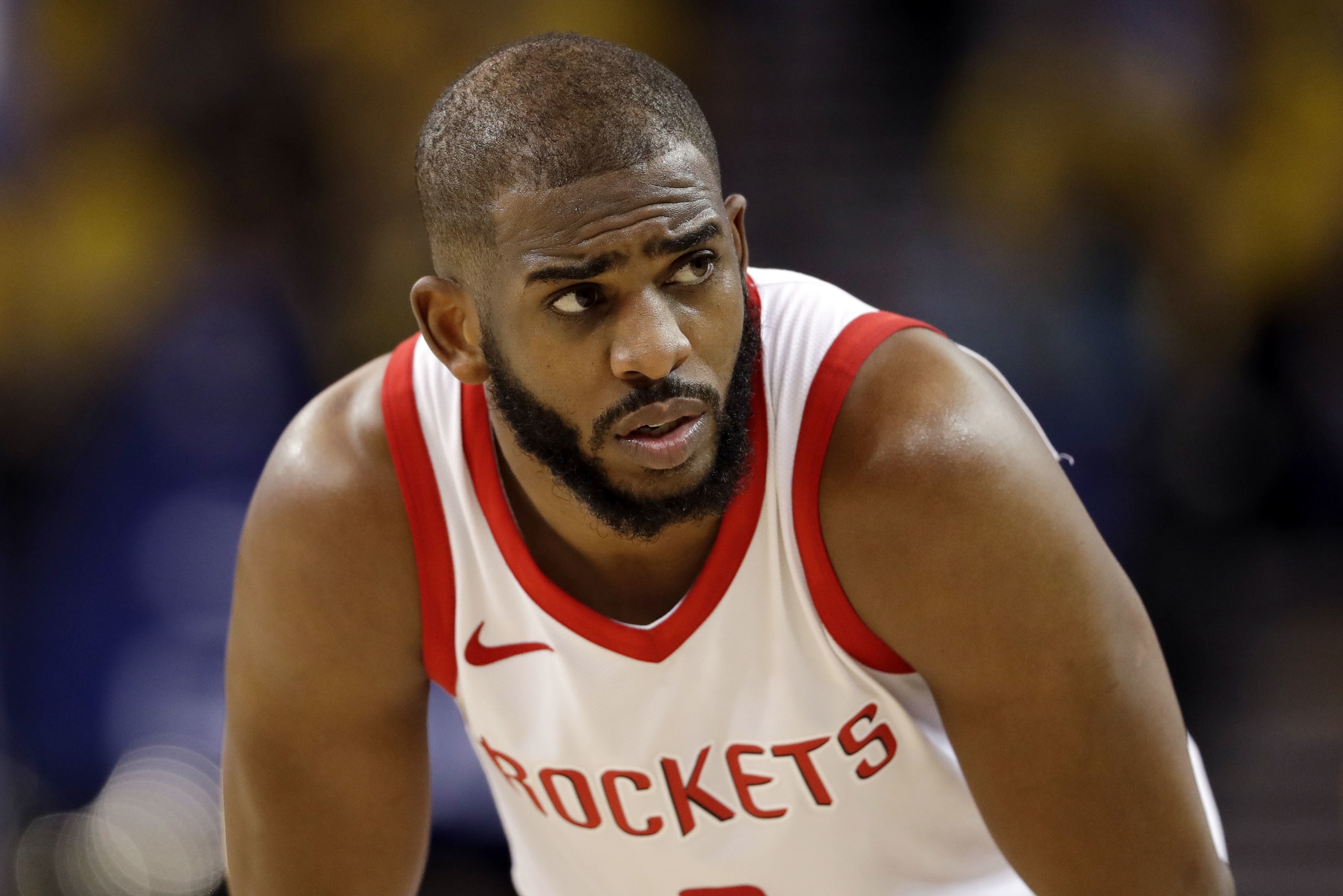 FILE - In this Tuesday, May 22, 2018, file photo, Houston Rockets' Chris Paul watches during the second half in Game 4 of the NBA basketball Western Conference Finals against the Golden State Warriors in Oakland, Calif. The Rockets will be without star guard Chris Paul for Game 6 because of a strained hamstring, a huge blow for a team trying to close out the Warriors. (AP Photo/Marcio Jose Sanchez, File)