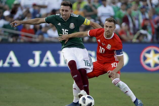 Wales' Tom Lockyer, right, pushes Mexico's Hector Herrera during the first half of their soccer match, Monday, May 28, 2018, in Pasadena, Calif. (AP Photo/Chris Carlson)