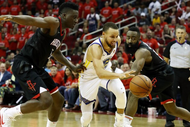 HOUSTON, TX - MAY 28:  Stephen Curry #30 of the Golden State Warriors drives against Clint Capela #15 and James Harden #13 of the Houston Rockets in the third quarter of Game Seven of the Western Conference Finals of the 2018 NBA Playoffs at Toyota Center on May 28, 2018 in Houston, Texas. NOTE TO USER: User expressly acknowledges and agrees that, by downloading and or using this photograph, User is consenting to the terms and conditions of the Getty Images License Agreement.  (Photo by Ronald Martinez/Getty Images)