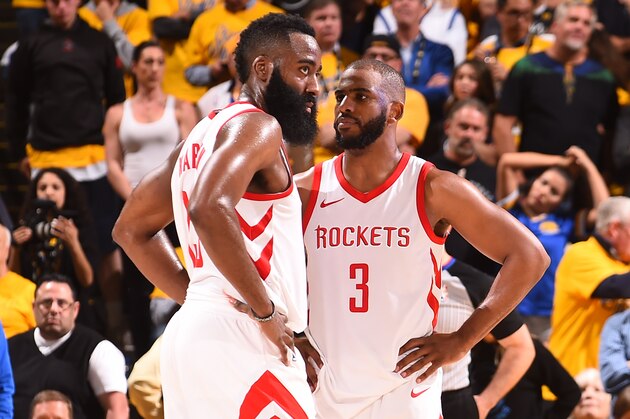 OAKLAND, CA - MAY 22:  Chris Paul #3 and James Harden #13 of the Houston Rockets talk during the game against the Golden State Warriors in Game Four of the Western Conference Finals of the 2018 NBA Playoffs on May 22, 2018 at ORACLE Arena in Oakland, California. NOTE TO USER: User expressly acknowledges and agrees that, by downloading and or using this photograph, user is consenting to the terms and conditions of Getty Images License Agreement. Mandatory Copyright Notice: Copyright 2018 NBAE (Photo by Noah Graham/NBAE via Getty Images)