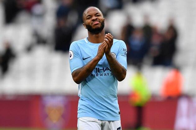 Manchester City's English midfielder Raheem Sterling applauds supporters on the pitch after the English Premier League football match between West Ham United and Manchester City at The London Stadium, in east London on April 29, 2018. - Manchester City won the game 4-1. (Photo by Ben STANSALL / AFP) / RESTRICTED TO EDITORIAL USE. No use with unauthorized audio, video, data, fixture lists, club/league logos or 'live' services. Online in-match use limited to 75 images, no video emulation. No use in betting, games or single club/league/player publications. /         (Photo credit should read BEN STANSALL/AFP/Getty Images)