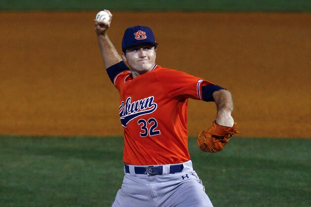 Auburn pitcher Casey Mize throws a pitch during the first inning of a Southeastern Conference tournament NCAA college baseball game against Texas A&M, Thursday, May 24, 2018, in Hoover, Ala. (AP Photo/Butch Dill)