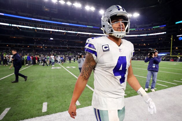 ARLINGTON, TX - DECEMBER 24:  Dak Prescott #4 of the Dallas Cowboys walks off the field after the Seattle Seahawks beat the Dallas Cowboys 21-12 at AT&T Stadium on December 24, 2017 in Arlington, Texas.  (Photo by Tom Pennington/Getty Images)