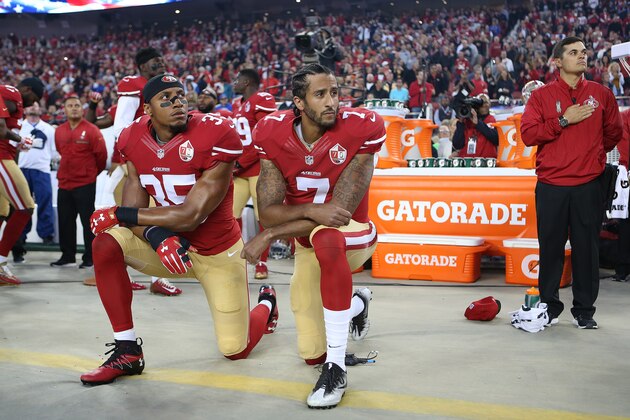 San Francisco 49ers Eric Reid (35) and Colin Kaepernick (7) take a knee during the National Anthem prior to their season opener against the Los Angeles Rams during an NFL football game Monday, Sept. 12, 2016, in Santa Clara, CA. The Niners won 28-0. (Daniel Gluskoter/AP Images for Panini)