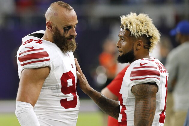 New York Giants wide receiver Odell Beckham, right, talks with teammate Mark Herzlich, left, during the first half of an NFL football game against the Minnesota Vikings Monday, Oct. 3, 2016, in Minneapolis. (AP Photo/Jim Mone)