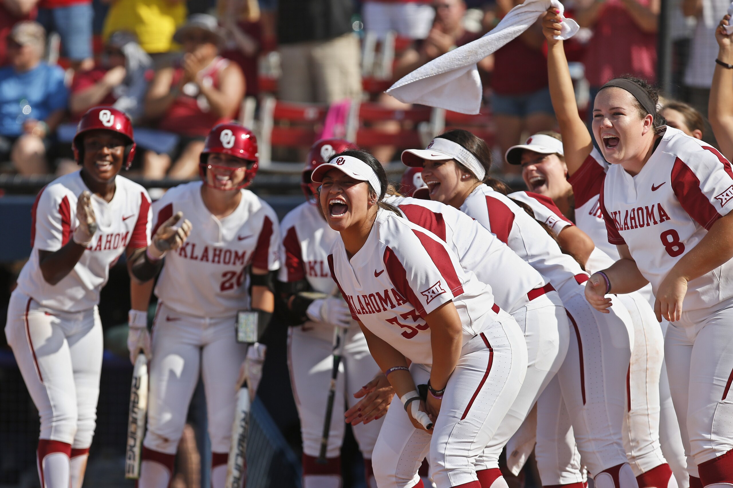 Oklahoma players celebrate at home plate as they wait for Nicole Pendley following a home run by Pendley against Baylor in the third inning during the championship game of the Big 12 softball tournament in Oklahoma City, Saturday, May 12, 2018. (AP Photo/Sue Ogrocki)