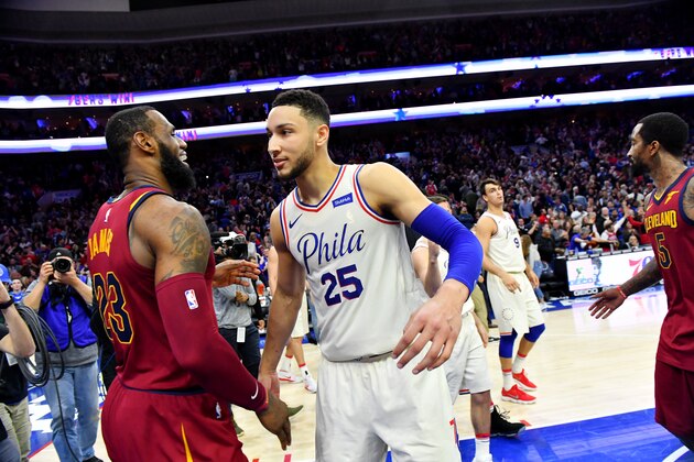 PHILADELPHIA, PA - APRIL 6:  LeBron James #23 of the Cleveland Cavaliers and Ben Simmons #25 of the Philadelphia 76ers exchange a hug after the game between the two teams on April 6, 2018 in Philadelphia, Pennsylvania NOTE TO USER: User expressly acknowledges and agrees that, by downloading and/or using this Photograph, user is consenting to the terms and conditions of the Getty Images License Agreement. Mandatory Copyright Notice: Copyright 2018 NBAE (Photo by Jesse D. Garrabrant/NBAE via Getty Images)
