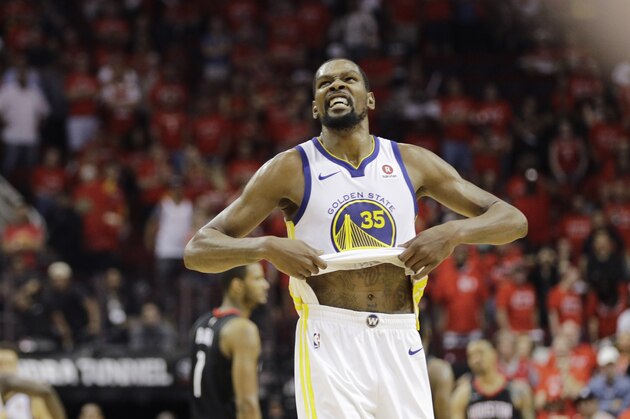 Golden State Warriors forward Kevin Durant (35) reacts as the Warriors defeat Houston Rockets in Game 7 of the NBA basketball Western Conference finals, Monday, May 28, 2018, in Houston. (AP Photo/David J. Phillip)