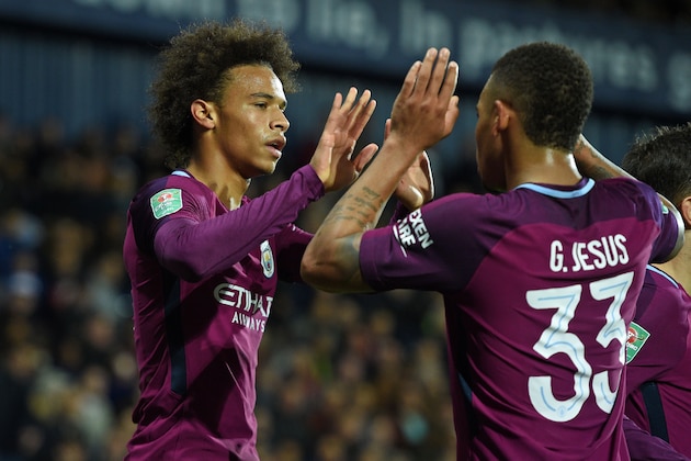Manchester City's German midfielder Leroy Sane (L) celebrates with Manchester City's Brazilian striker Gabriel Jesus after scoring their second goal during the English League Cup third round football match between West Bromwich Albion and Manchester City at The Hawthorns in West Bromwich, central England September 20, 2017. / AFP PHOTO / Oli SCARFF / RESTRICTED TO EDITORIAL USE. No use with unauthorized audio, video, data, fixture lists, club/league logos or 'live' services. Online in-match use limited to 75 images, no video emulation. No use in betting, games or single club/league/player publications.  /         (Photo credit should read OLI SCARFF/AFP/Getty Images)