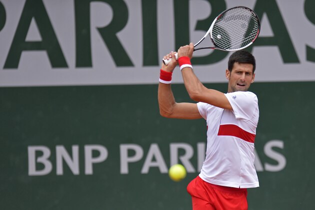 PARIS, FRANCE - MAY 30:  Novak Djokovic of Serbia plays a backhand during his mens singles second round match against Jaume Munar of Spain during day 4 of the 2018 French Open at Roland Garros on May 30, 2018 in Paris, France.  (Photo by Aurelien Meunier/Getty Images)