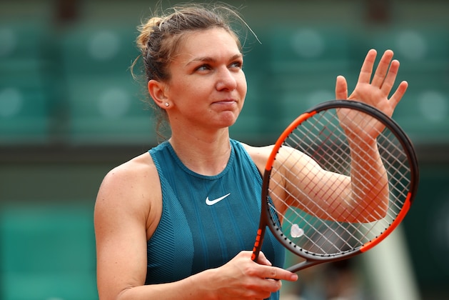 PARIS, FRANCE - MAY 30:  Simona Halep of Romania celebrates victory folowing her ladies singles second round match against Alison Riske of The United States during day four of the 2018 French Open at Roland Garros on May 30, 2018 in Paris, France.  (Photo by Cameron Spencer/Getty Images)
