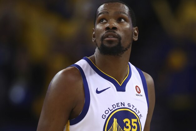 Golden State Warriors' Kevin Durant looks at the scoreboard during the fourth quarter in Game 5 of a first-round NBA basketball playoff series against the San Antonio Spurs Tuesday, April 24, 2018, in Oakland, Calif. (AP Photo/Ben Margot)