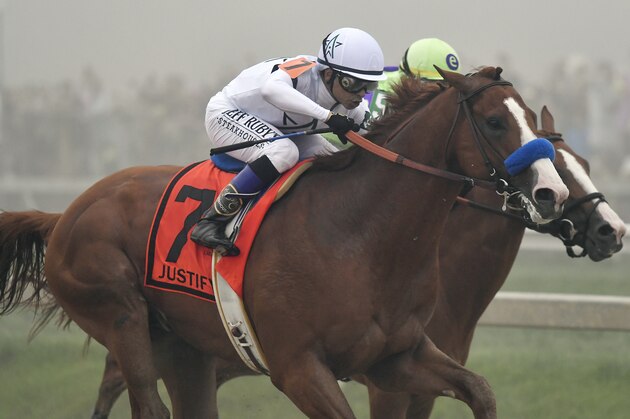 Justify (7), with Mike Smith aboard, runs against Good Magic, with Jose Ortiz atop, in the final stretch of the 143rd Preakness Stakes horse race at Pimlico race track, Saturday, May 19, 2018, in Baltimore. Justify won the race. (AP Photo/Tom Horan)