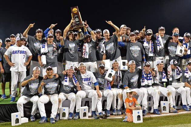 OMAHA, NE - JUNE 27:  Players of the Florida Gators hold up the National Championship Trophy after defeating the LSU Tigers 6-1  at the College World Series on June 27, 2017 at TD Ameritrade Park in Omaha, Nebraska.  (Photo by Peter Aiken/Getty Images)