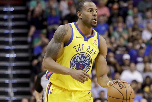 Golden State Warriors forward Andre Iguodala brings the ball down court against the Phoenix Suns during an NBA basketball game in Phoenix, Sunday, March 18, 2018. (AP Photo/Chris Carlson)