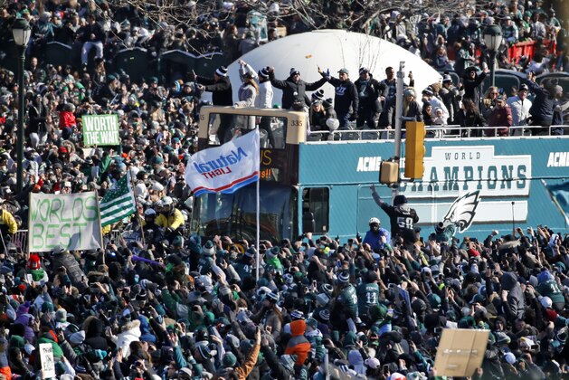 Fans cheer as a bus with team members arrives near the Philadelphia Museum of Art during a Super Bowl victory parade for the Philadelphia Eagles football team, Thursday, Feb. 8, 2018, in Philadelphia. The Eagles beat the New England Patriots 41-33 in Super Bowl 52. (AP Photo/Alex Brandon)