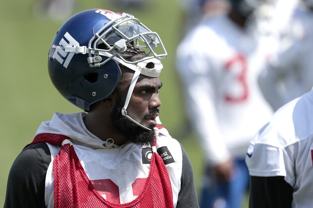 New York Giants running back Saquon Barkley attends the team's NFL football organized team activities, Tuesday, May 29, 2018, in East Rutherford, N.J. (AP Photo/Julio Cortez)